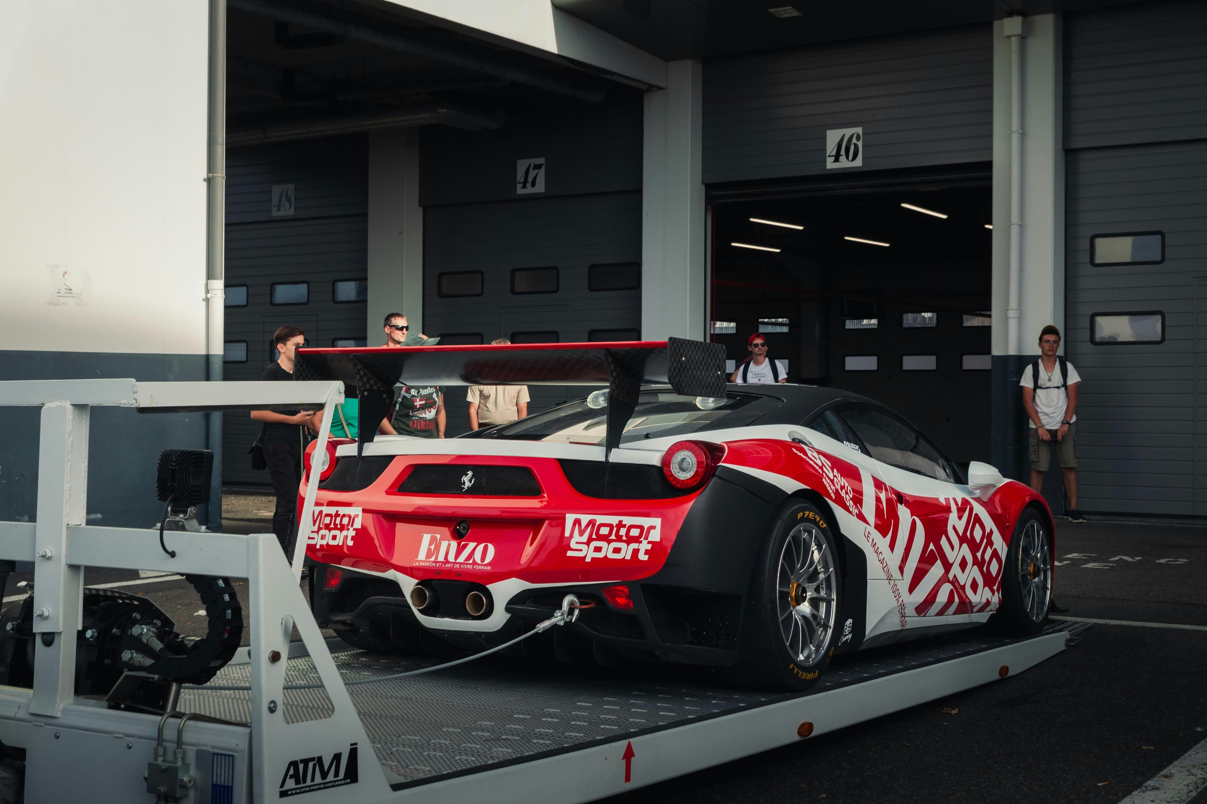 Race car winched onto the back of a transporter